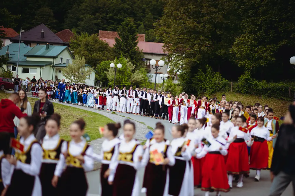 Performers in traditional dress at a cultural gathering in Montenegro