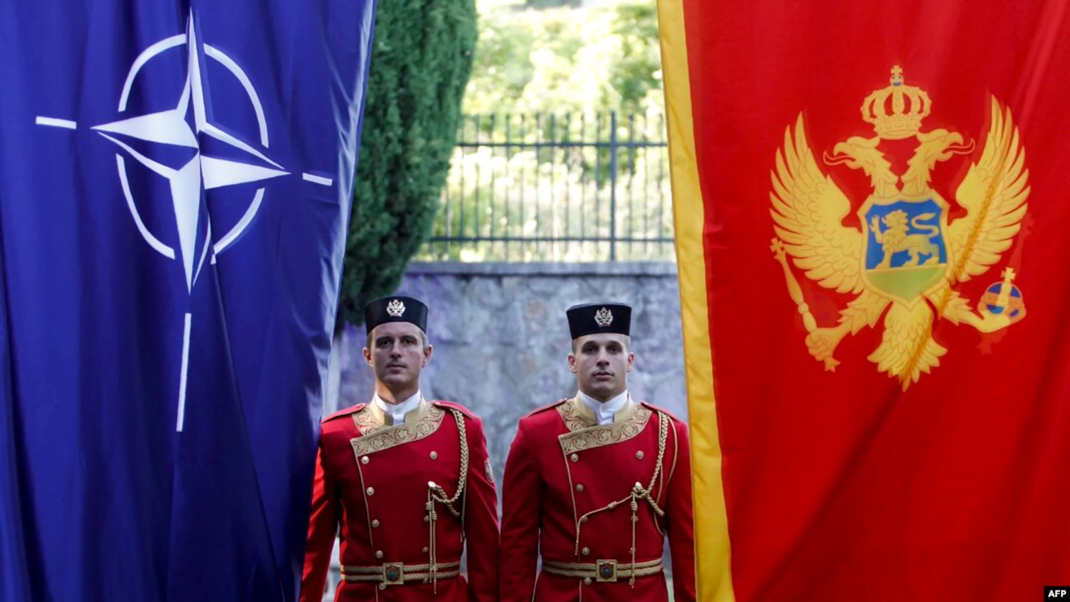 Montenegro and NATO flags at an official event